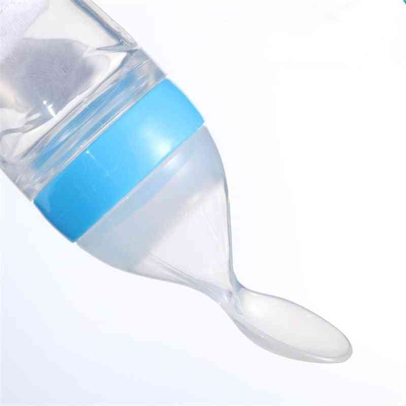 Silicone Squeezing Bottle With Attached Spoon For Feeding To Babies