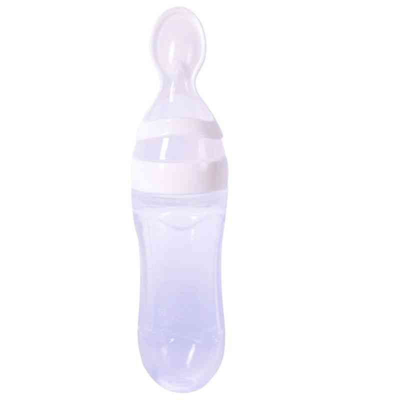 Novorojenček, ki stisne stekleničko za hranjenje - silikonska riževa žlička za trening