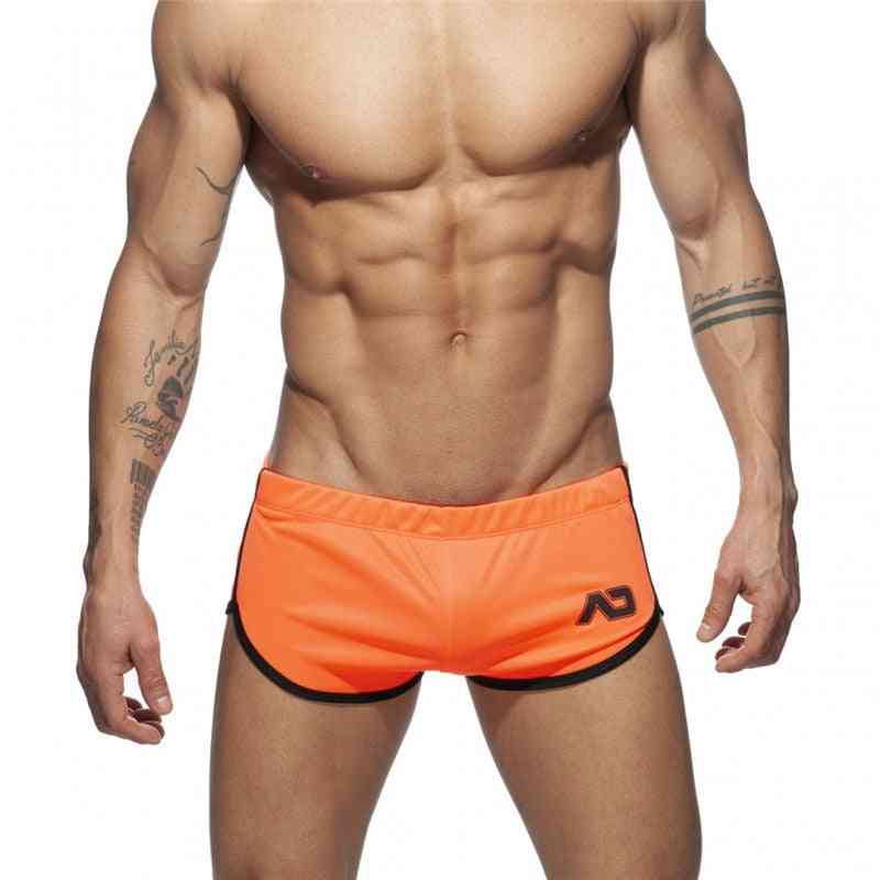 Nya mäns badkläder solida strandbrädeshorts fitness sommarstrandkläder som kör havsbränning