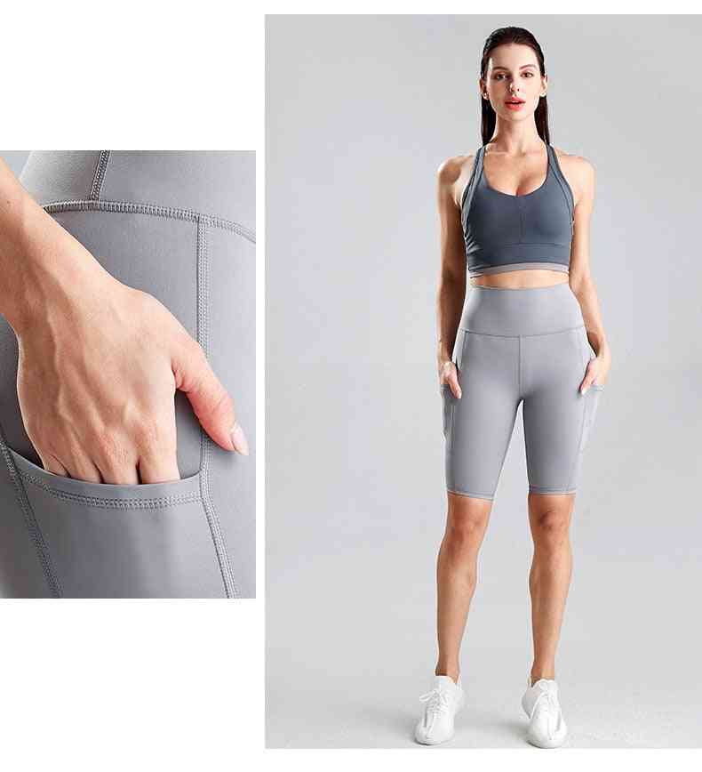 Kvinnor cyklar löpande fitness byxor, hög midja push up höft sidoficka gym shorts