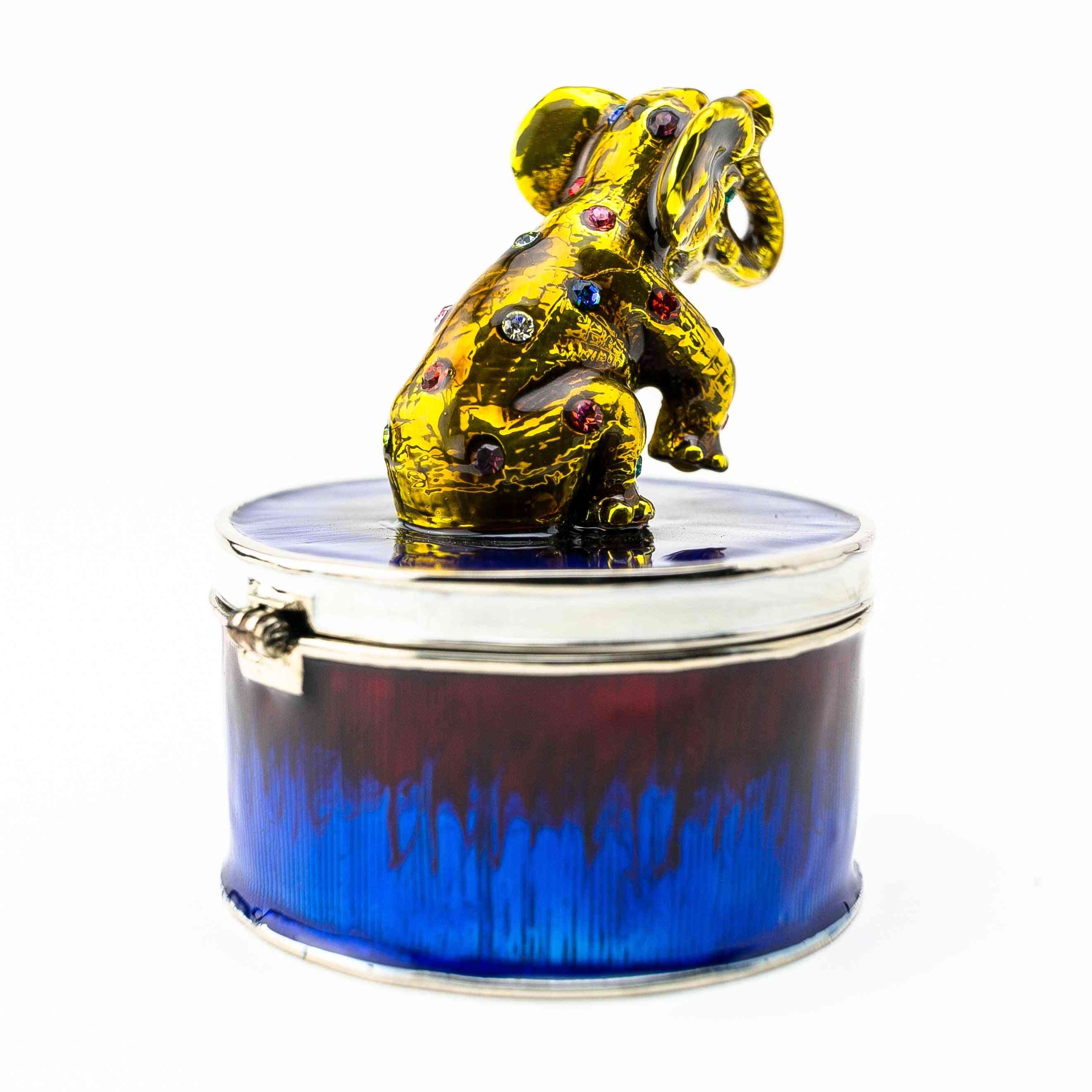 Elefante d'oro su scatola gingillo blu