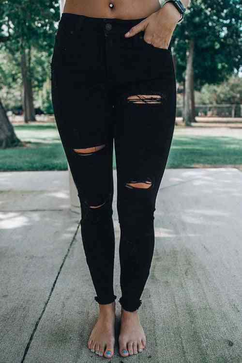 Ulykkelige slidser i jeans med høj talje